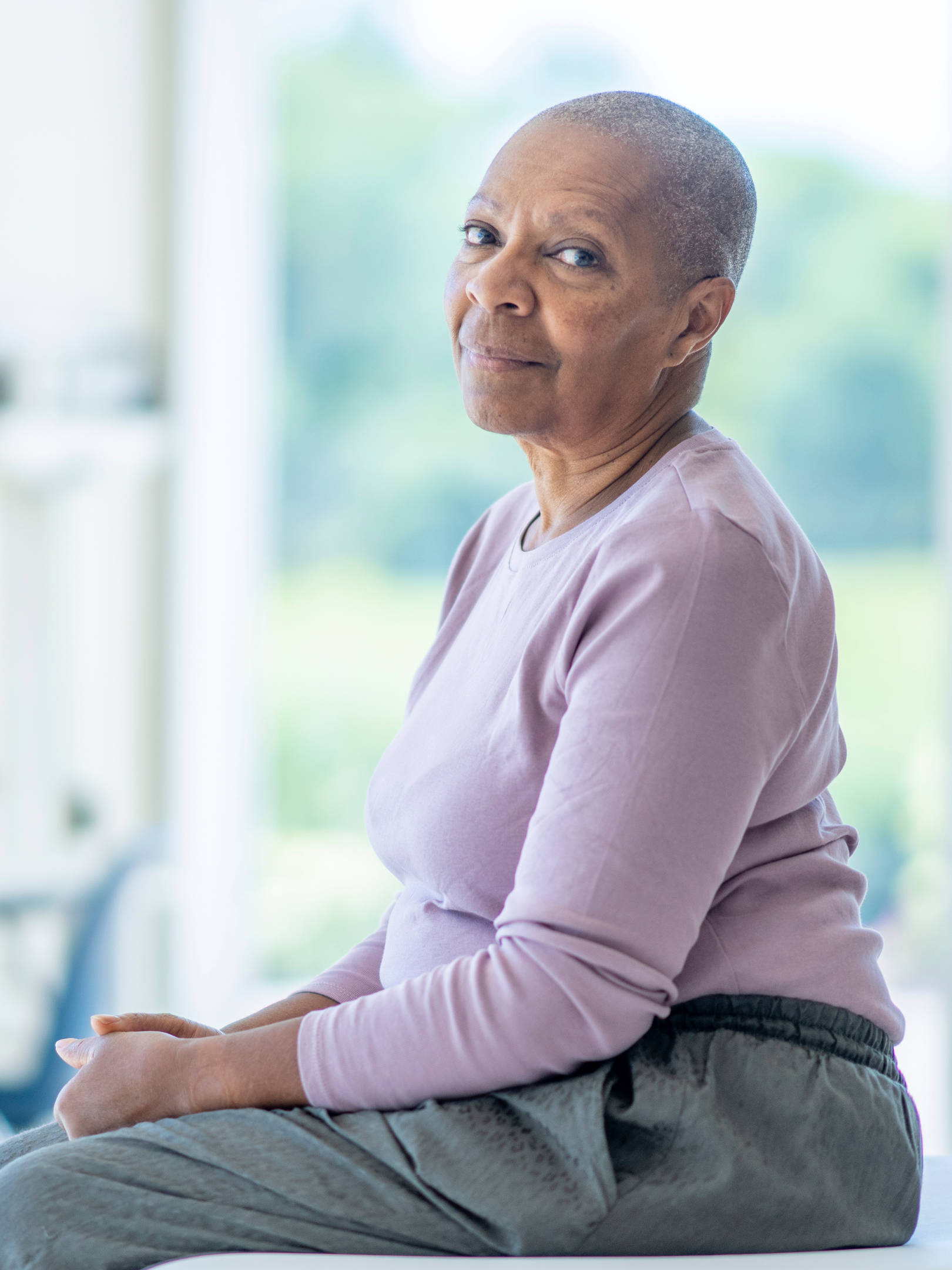 Seated woman in a clinical trial